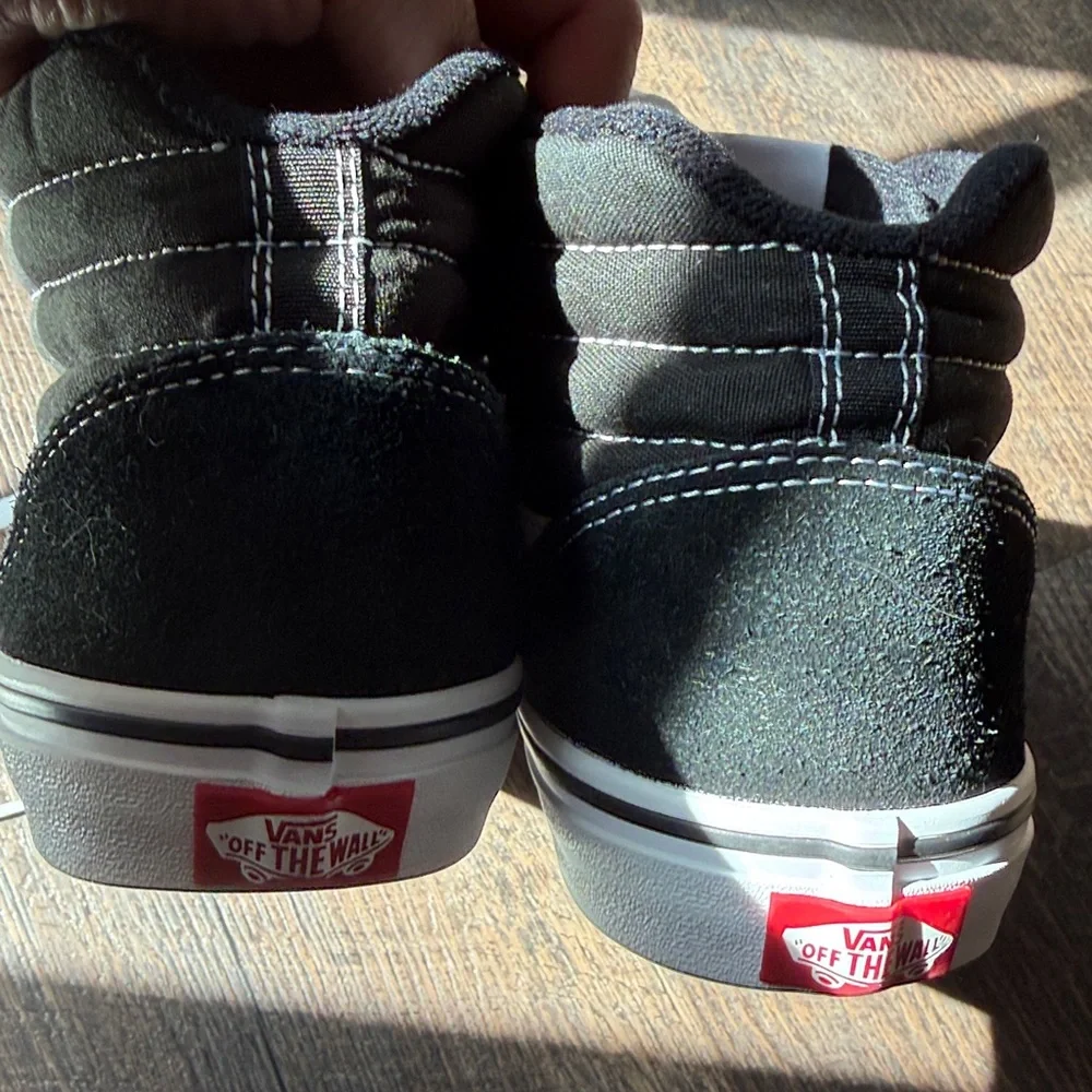 Vans Off The Wall Black and White High-Top Skate Sneakers